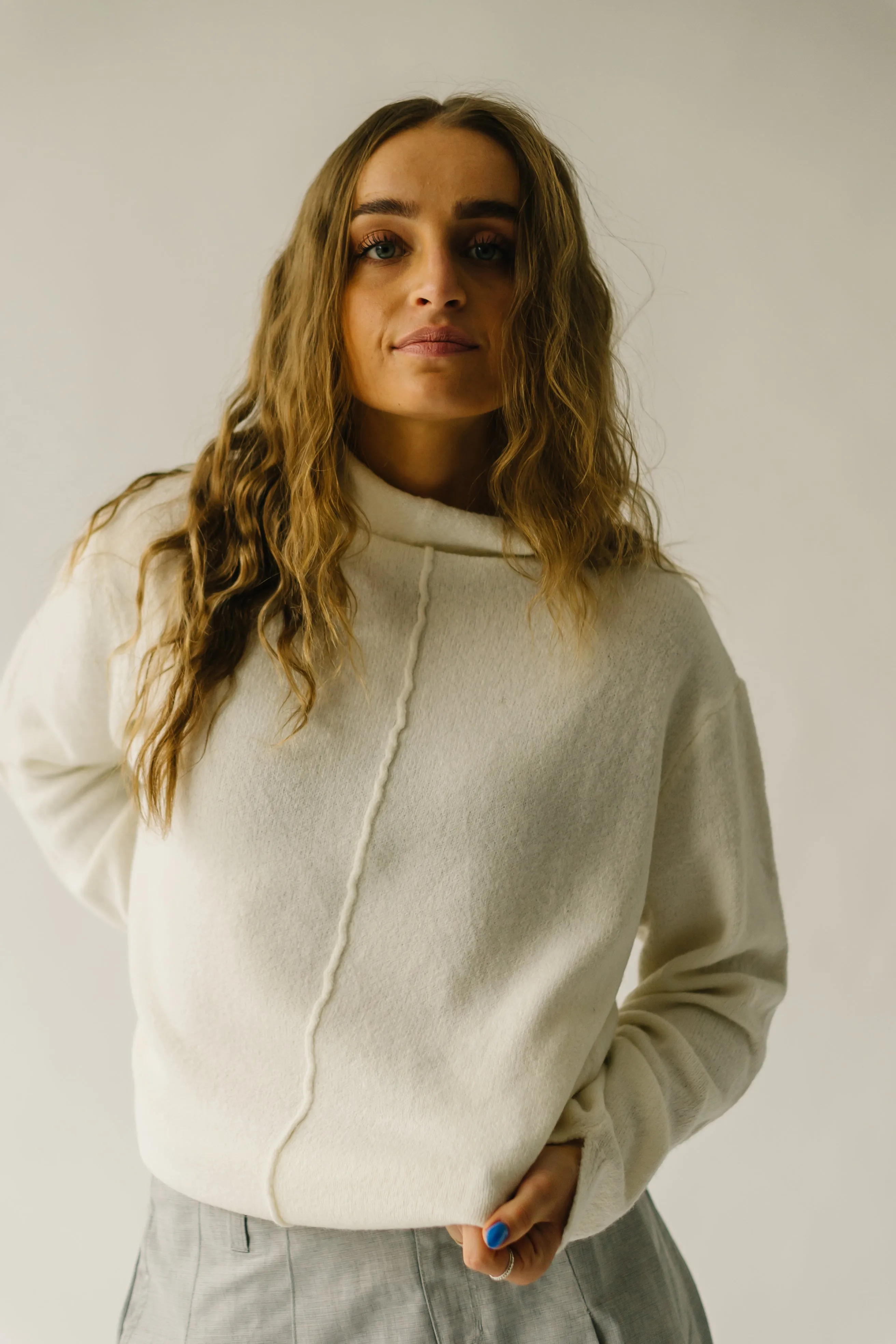 The Tindle Mock Neck Sweater in Cream